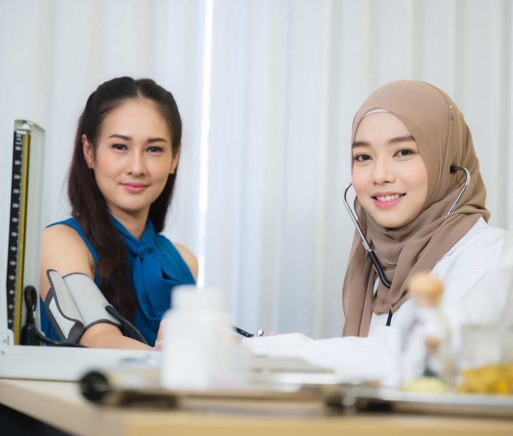 muslim doctors explain the health examination results to patient that receives annual health checks