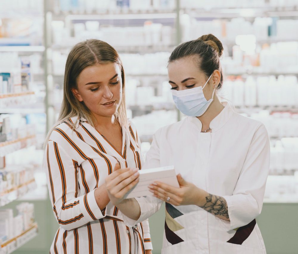 woman pharmacist checking medicine in pharmacy